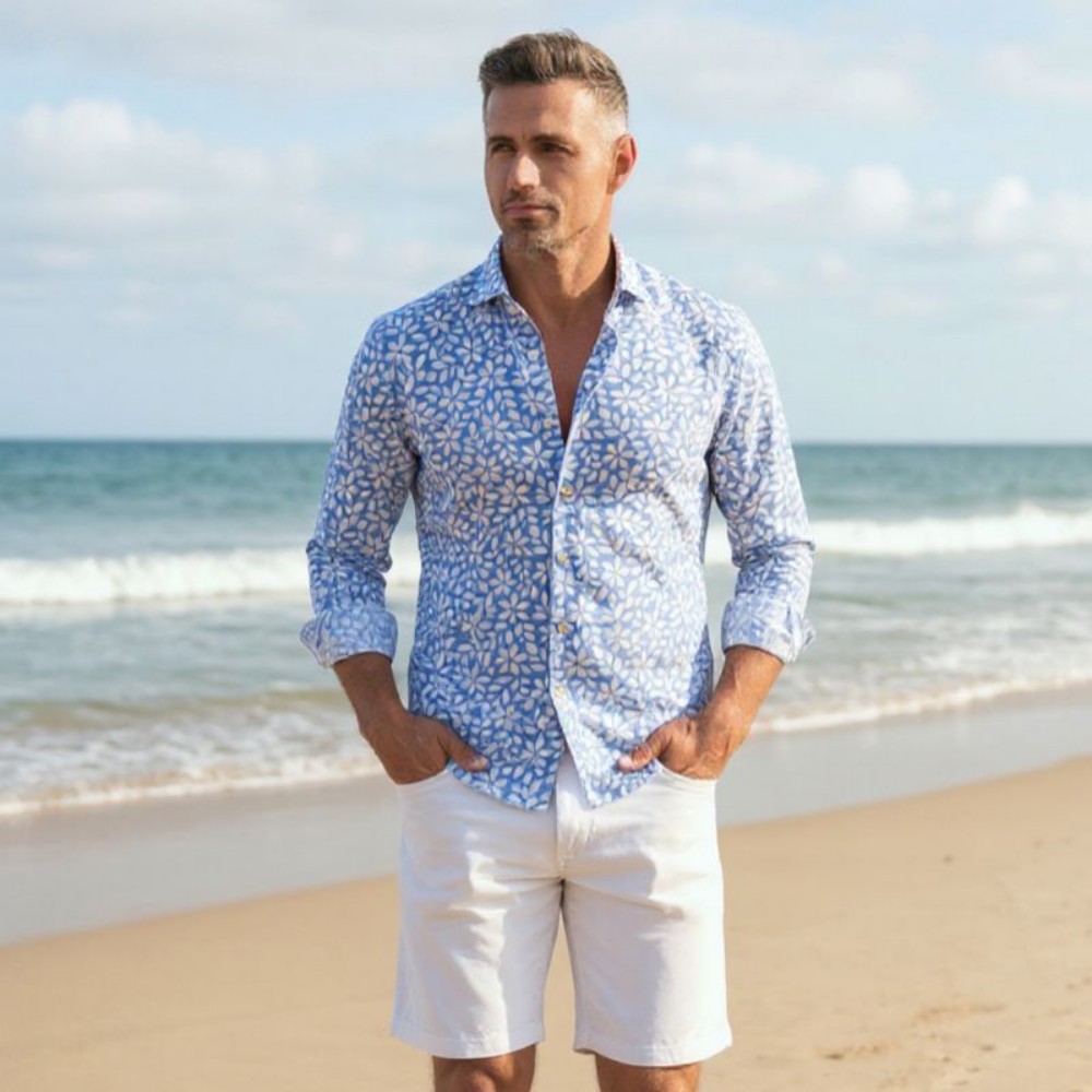 Immagine di Camicia in cotone azzurra con fantasia floreale bianca